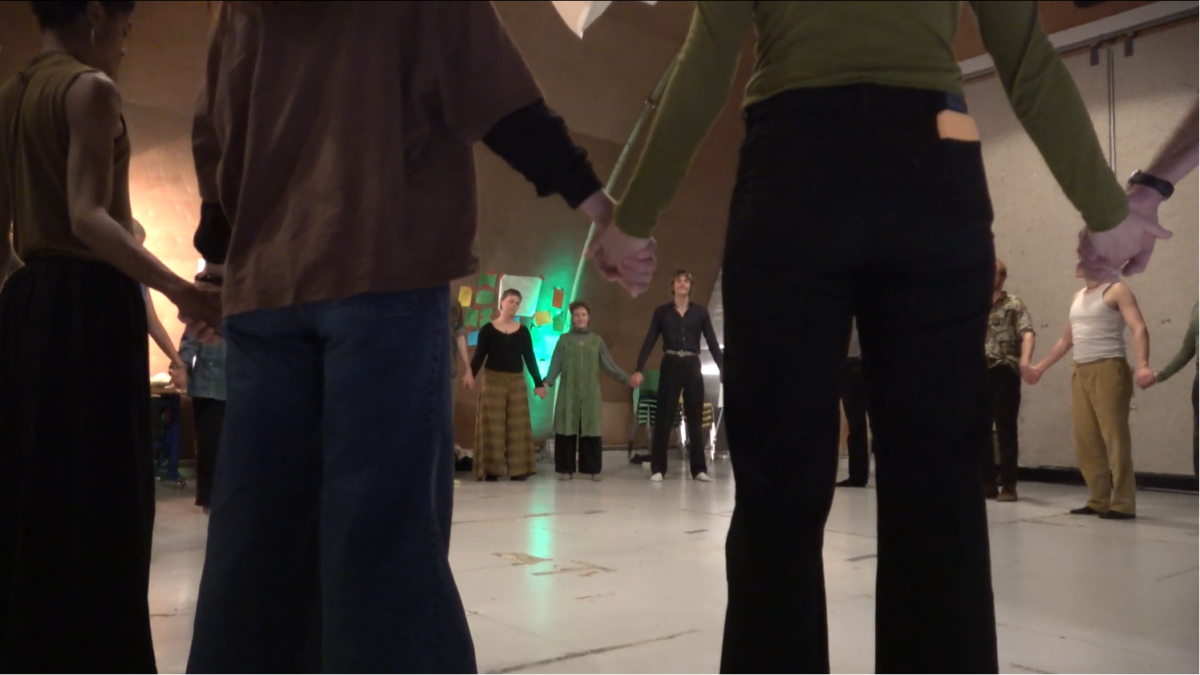 Group in a circle holding hands